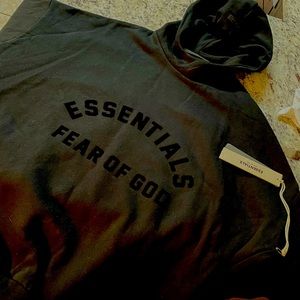 New with tags- jet black men’s size medium Essentials Fear of God Hoodie.